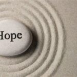a rock inscribed "hope"