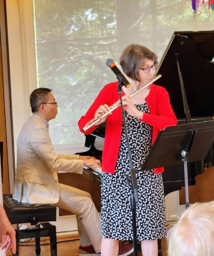 Milton and Christine performing on piano and flute.