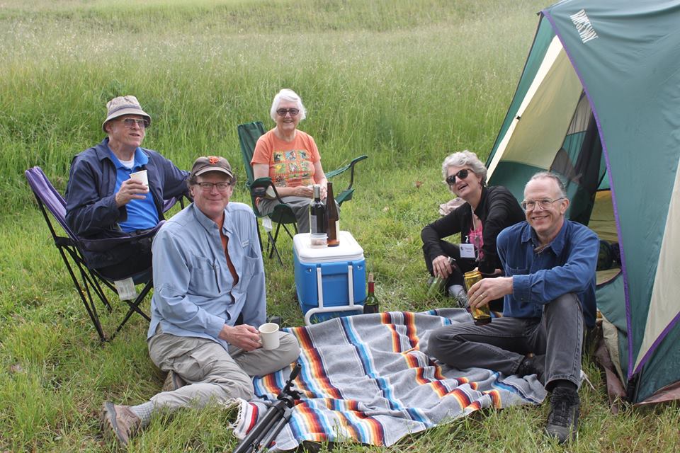 Smiling people having a picnic