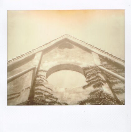 sepia image of the front gable of a church