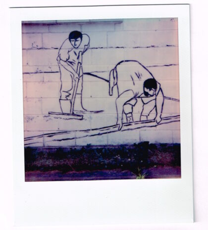 drawing on a wall showing a couple of people working the ground