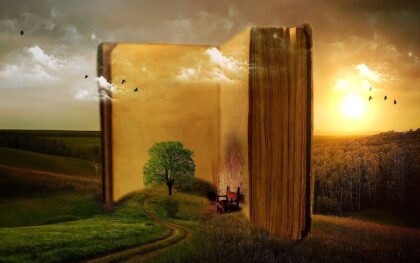 a forest scene coming out of an open book