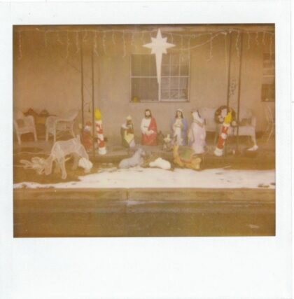 Christmas scene outside of a house.