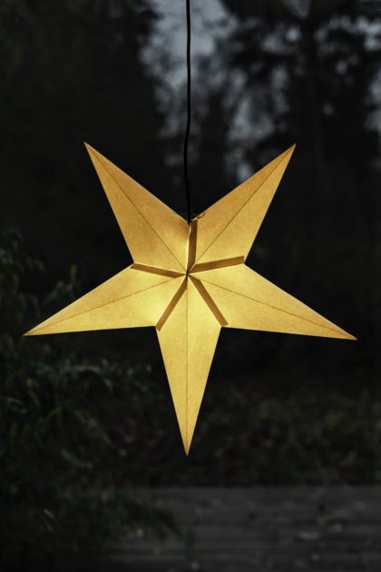 Golden star hanging in a window