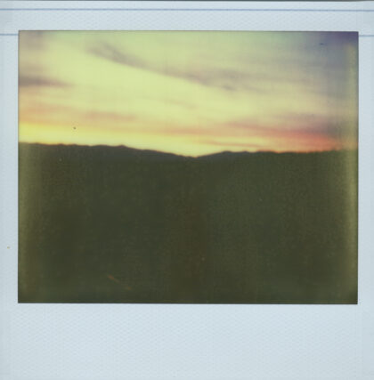 Hazy polaroid photo of distant sunset