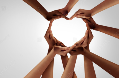 many hands together making the shape of a heart