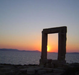 Large stone portal on a beach