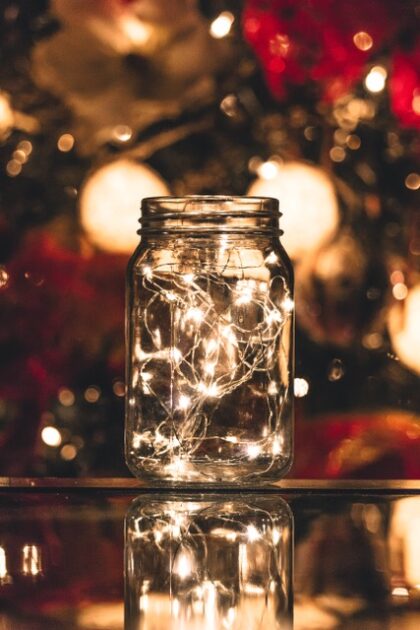 Empty jar in front of a Christmas tree