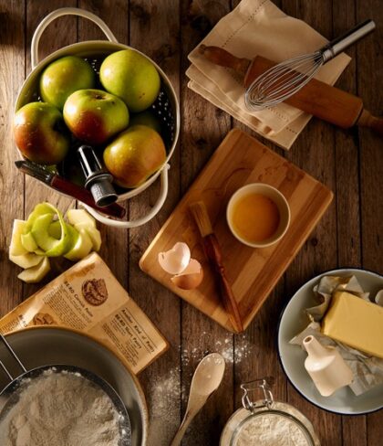 Cutting board with cheese and apples