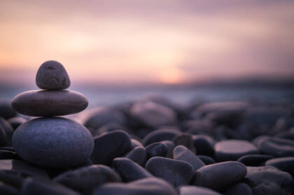 Sunset on pebbles in Nice, France.